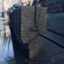Rough concrete and rebar after a wash.